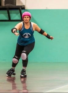 Action shot of Racy Gracie skating on the track